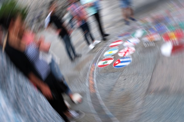 ICM photo of people staring at flags drawn on the ground by Monique Youakim Elia
